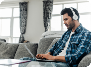 man on laptop with headphones